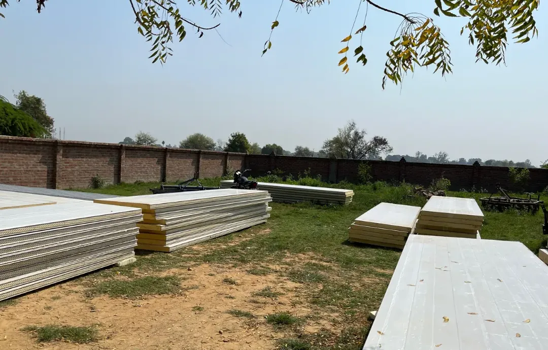 PUF panels delivered and stacked on a client's site before installation